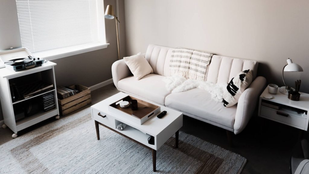 Minimalistic living room with clean lines and simple furnishings for a sleek look.